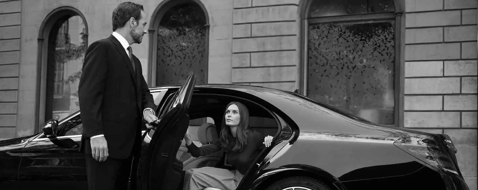 Real Blacklane chauffeur Peter gets out of his Mercedes, ready to greet his guest.